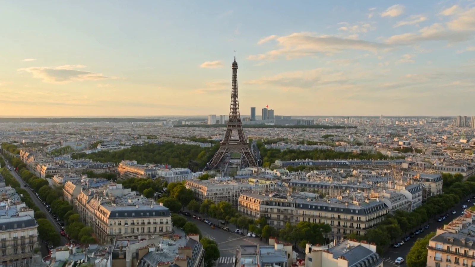 Paris rooftops in the evening light, where the Click First story of Monsieur Click, SEO agency, begins
